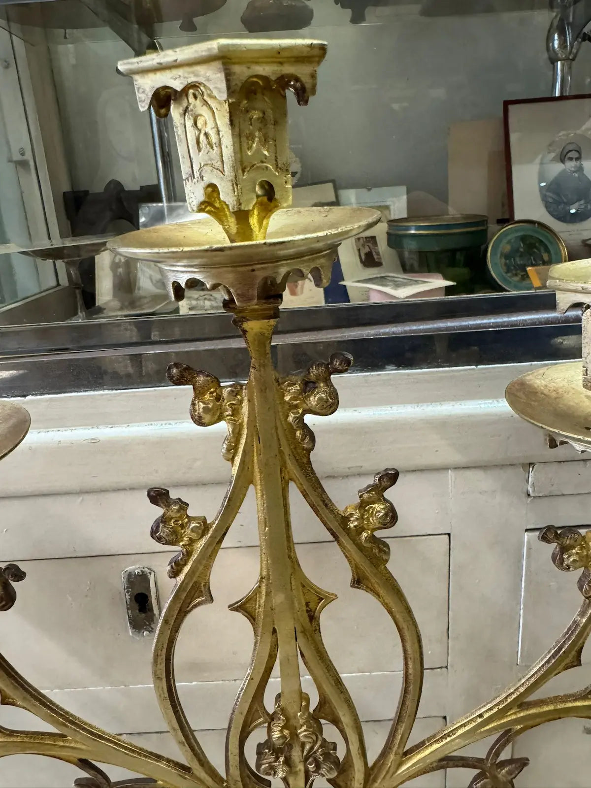 Large neo-Gothic gilded bronze altar candelabra with ornate scrollwork and nine candle holders / Grands chandeliers d’autel en bronze doré de style néogothique à neuf lumières