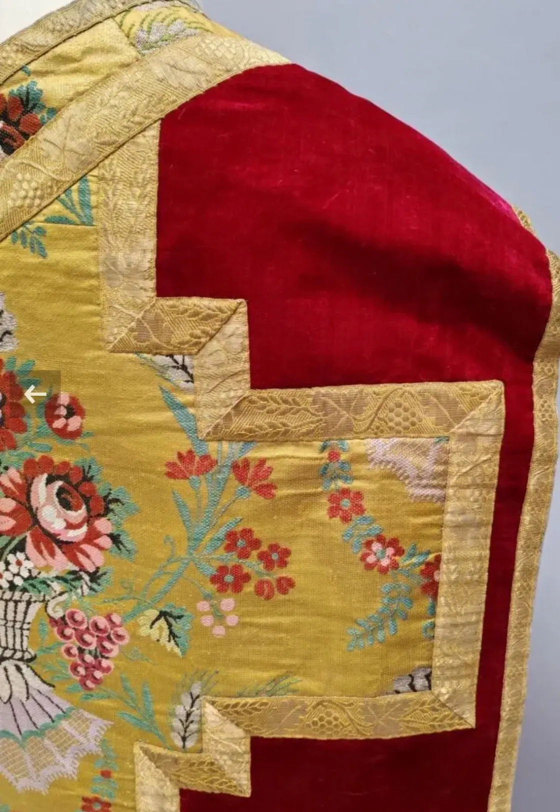 Antique red silk velvet chasuble with colorful floral embroidered orphrey and cross design
/
Chasuble ancienne en velours de soie rouge avec orfrois brodés floraux polychromes